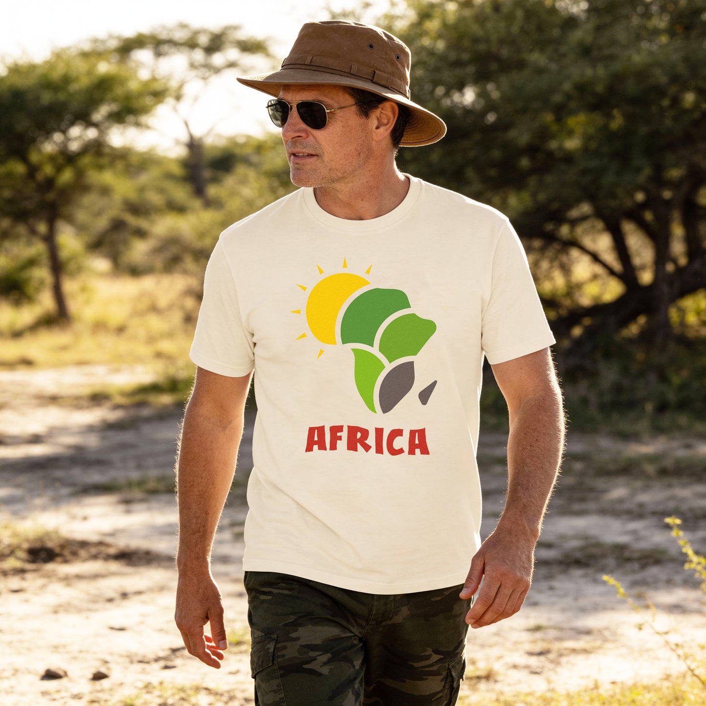 Man wearing a white t-shirt with 'AFRICA' design outdoors