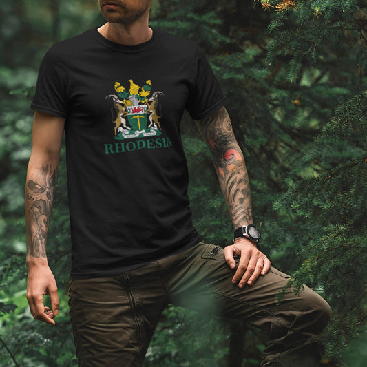 A person wearing a black crew neck t-shirt with the Rhodesia Coat of Arms printed on the front.